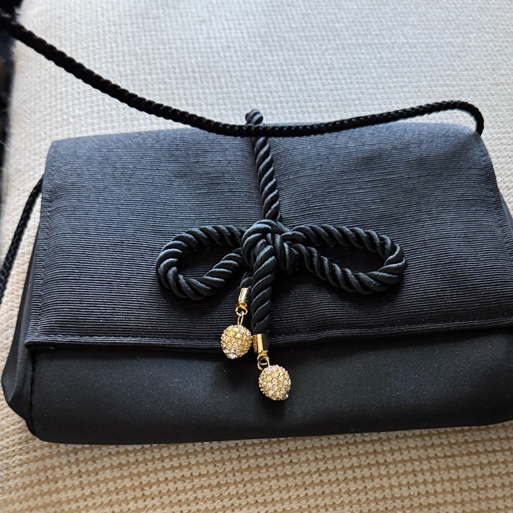 Black Clutch with Gold Details. 9x6. Interior zipper pocket.